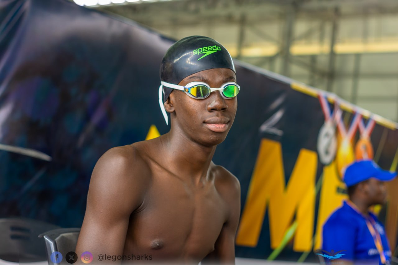 Teenage male athlete Speedo cap pre-race portrait