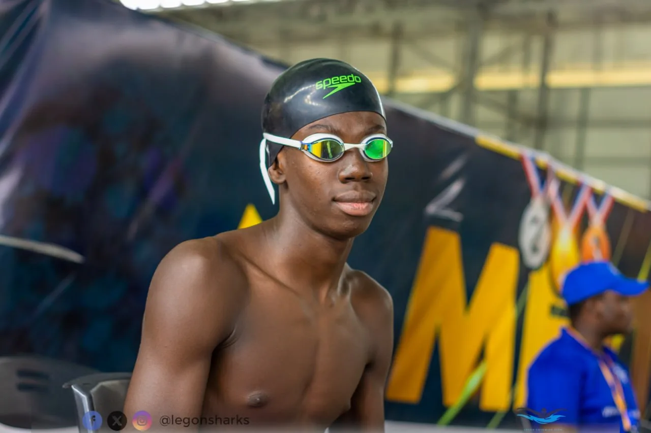Teenage male athlete Speedo cap pre-race portrait