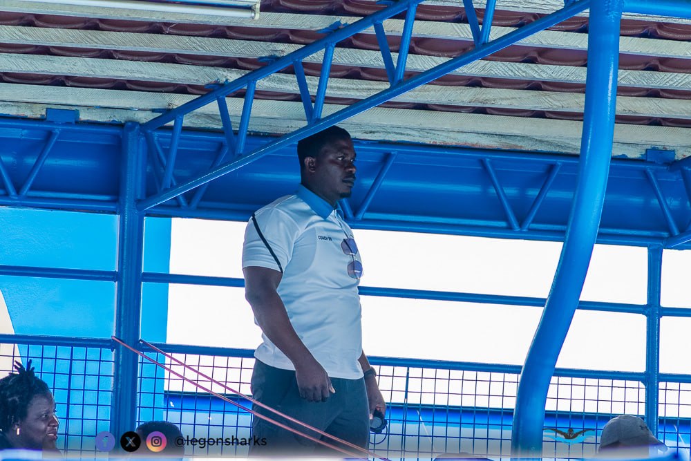 Coach watching from pool deck