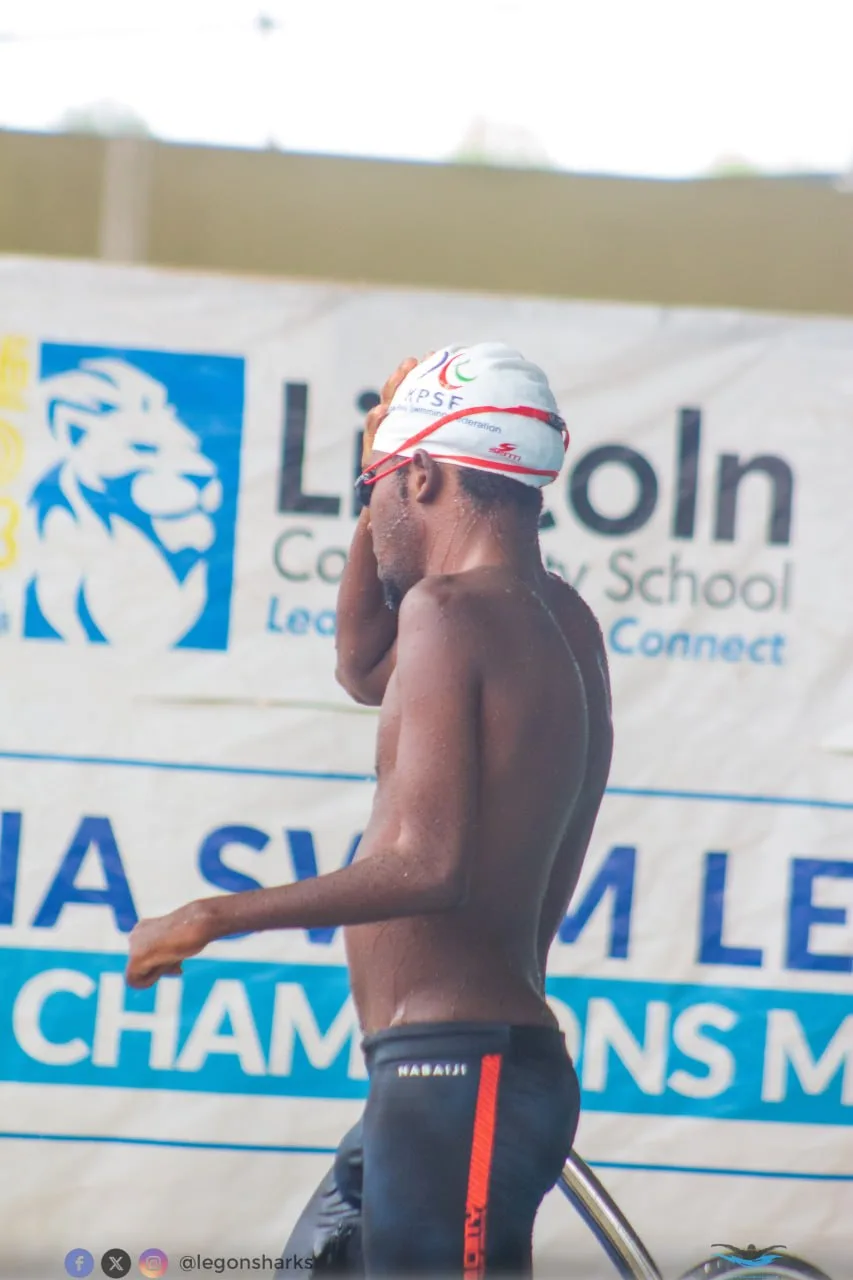 Swimmer finishing a race