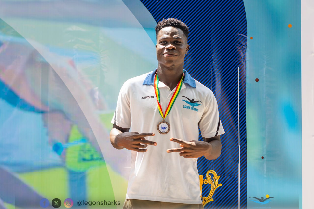 Jonathan celebrating with medal