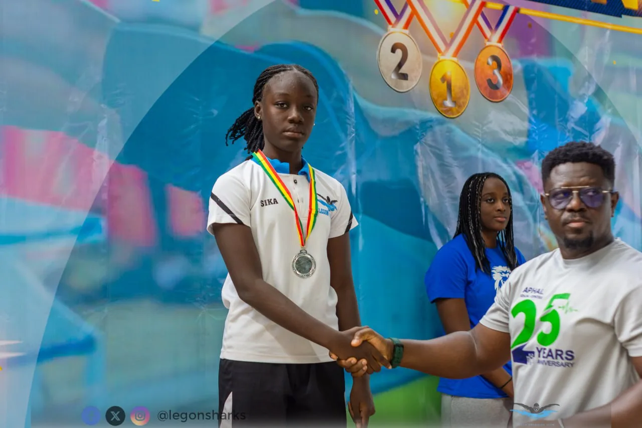 Sika receiving silver medal